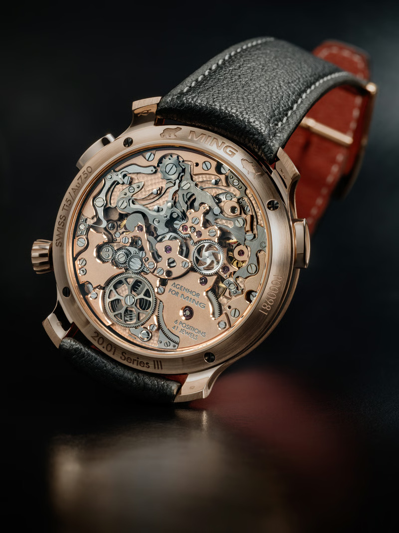 Caseback of the Ming 20.01 Series III in rose gold showing the AgenGraphe central-chronograph movement engraved 'Agenhor for MING'.