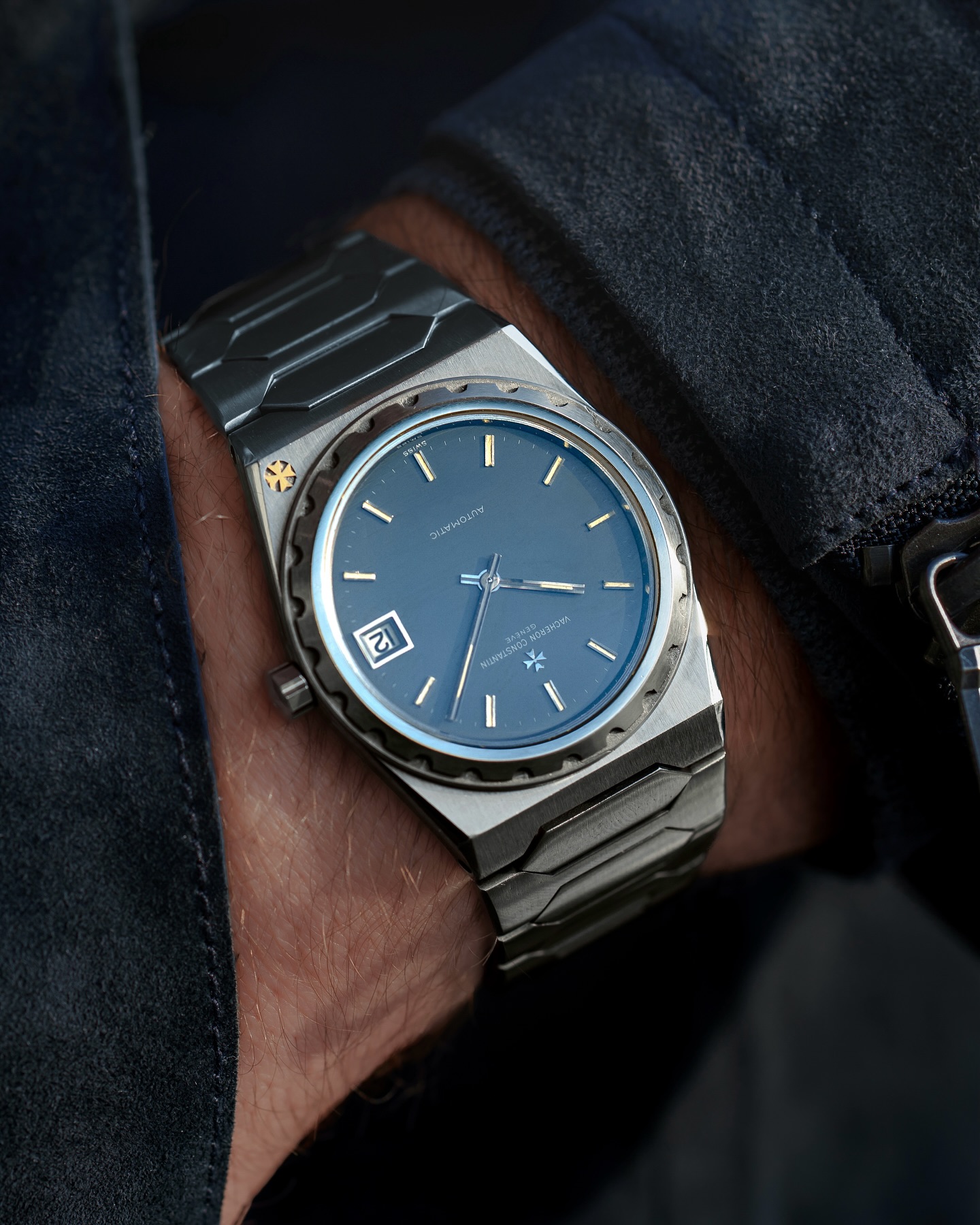 Vacheron Constantin 222 in steel with blue dial and yellow gold Maltese cross on the bezel, on the wrist.